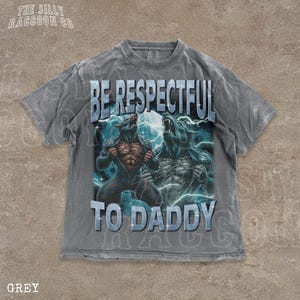 A grey t-shirt with a graphic design featuring two werewolves and the text "BE RESPECTFUL TO DADDY" printed on it.