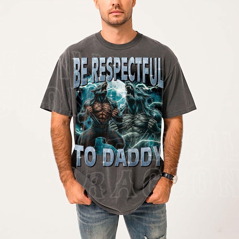 A man wearing a gray t-shirt with a graphic design featuring two werewolves and the text "BE RESPECTFUL TO DADDY".