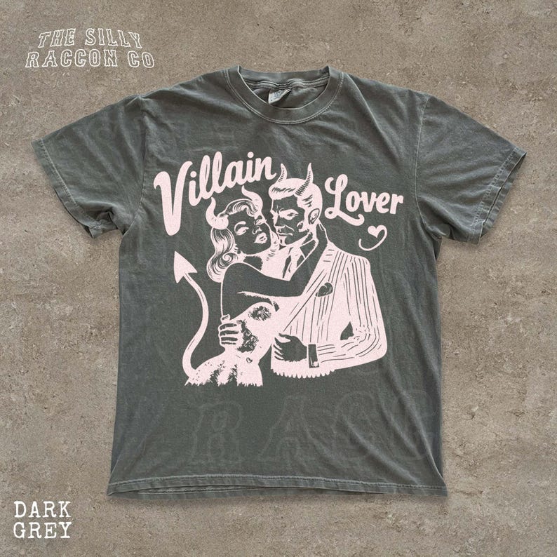 A gray t-shirt with a graphic design featuring a man and a woman embracing, with the text " Villain Lover" above them.