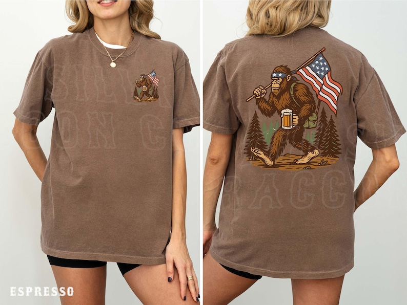 a woman wearing a brown t-shirt with an illustration of a giant gorilla holding an American flag and a mug.