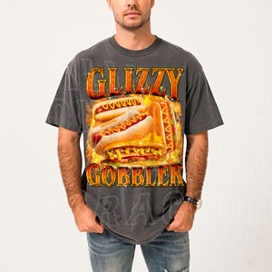 A man wearing a gray t-shirt with a graphic design of two hot dogs on a bun.