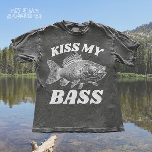 a t - shirt that says kiss my bass on it