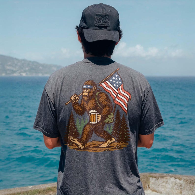 a man standing on a cliff overlooking the ocean