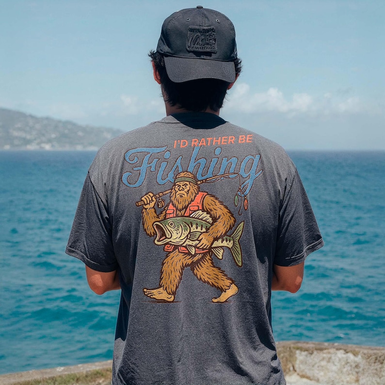a man standing on top of a cliff next to the ocean