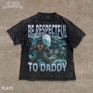 A black t-shirt with a graphic design featuring two werewolves and the text "BE RESPECTFUL TO DADDY" printed on it.