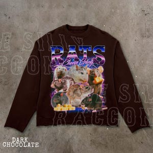 A brown sweatshirt with a graphic design featuring a group of rats and cheese.