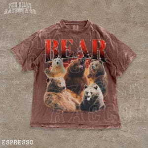 A t-shirt with a graphic design featuring a group of bears, including a large bear in the center surrounded by smaller bears.