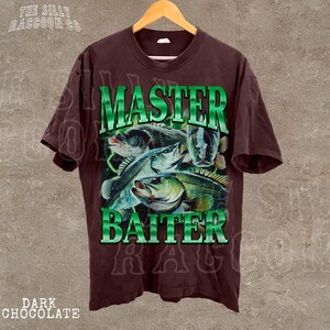 A dark brown t-shirt with a graphic design featuring a fish and the text "MASTER BAITER" in green and white.