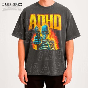 a graphic t-shirt with a skull and flames, along with the text "ADHD" prominently displayed.