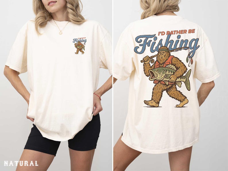A woman wearing a white t-shirt with a graphic design of a fishing giant on the back.
