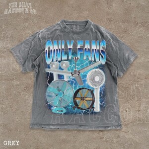 A grey t-shirt with a graphic design featuring various fans and a lightning bolt background.