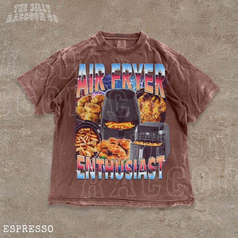 The image is a t-shirt with a graphic design featuring various kitchen appliances, including an air fryer, a toaster, and a blender, along with the text "AIR FRYER ENTHUSIAST" and "ESPRESSO".
