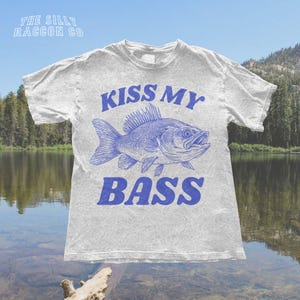 a t - shirt that says kiss my bass on it