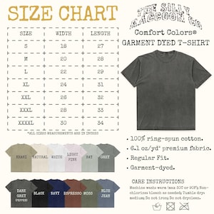 The image is a size chart for a garment dyed t-shirt from The Silky Raccoon Co. It provides measurements for different sizes, including S, M, L, XL, XXL, and XXXL, along with corresponding color options such as Khaki, Light Pink, Light Blue, and Regular Fit. The chart also includes a list of care instructions for the garment, such as machine washing and tumble drying.