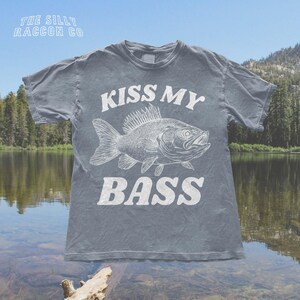 a t - shirt that says kiss my bass on it