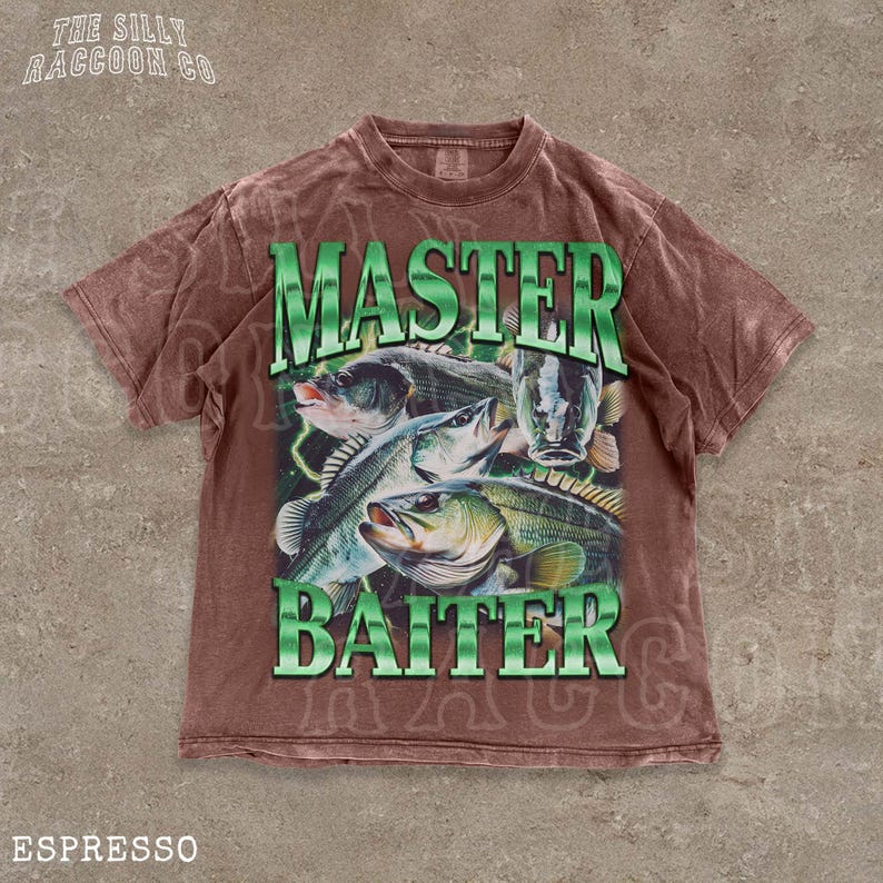 A brown t-shirt with a graphic design featuring a fish and the text "MASTER BAITER" printed on it.