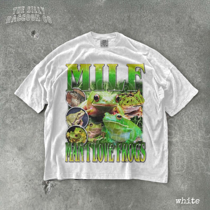 A white t-shirt with a graphic design featuring a collage of images of various frogs.