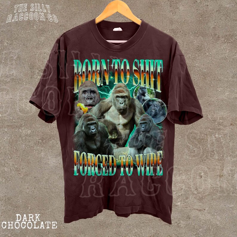 A t-shirt with a graphic design featuring a group of gorillas and the text "BORN TO SHIT FORCED TO WIPE" printed on it.