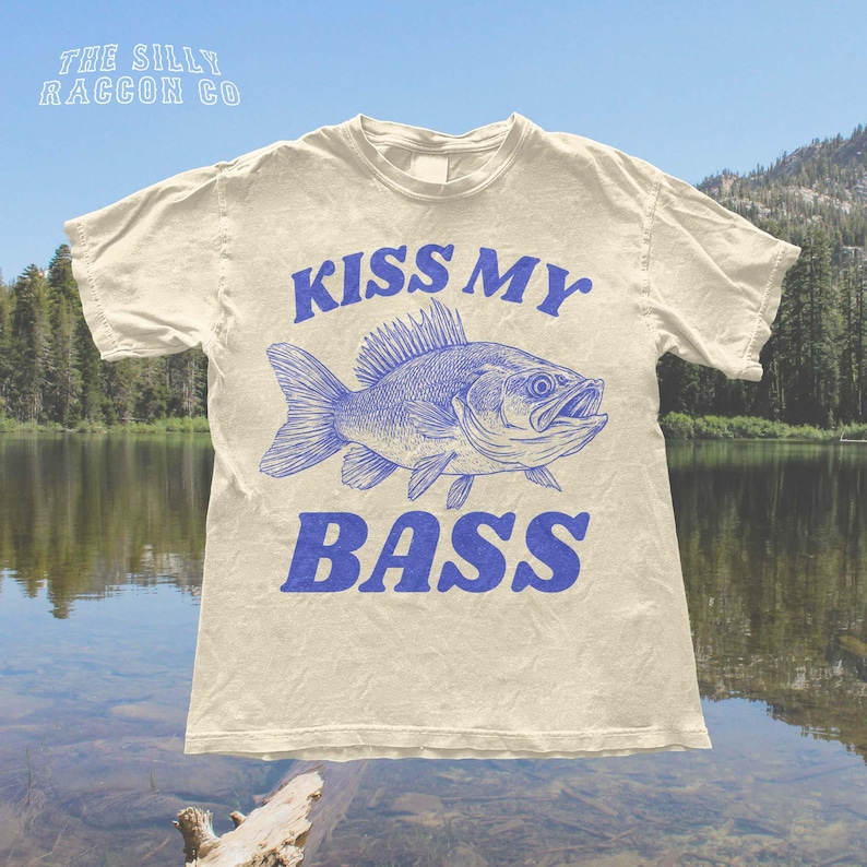 a t - shirt that says kiss my bass on it