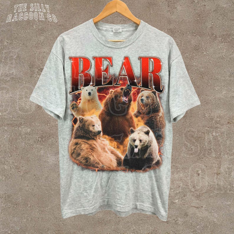 A grey t-shirt with a graphic design featuring a group of bears in various poses and expressions.