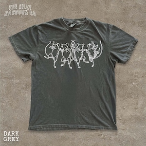 A gray t-shirt with a graphic design of five cartoon mice dancing together.