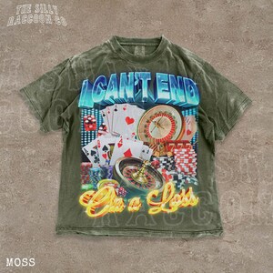A t-shirt with a graphic design featuring casino-related elements such as playing cards, a roulette wheel, and poker chips, along with the text "I CAN'T END" and "On a Loss".