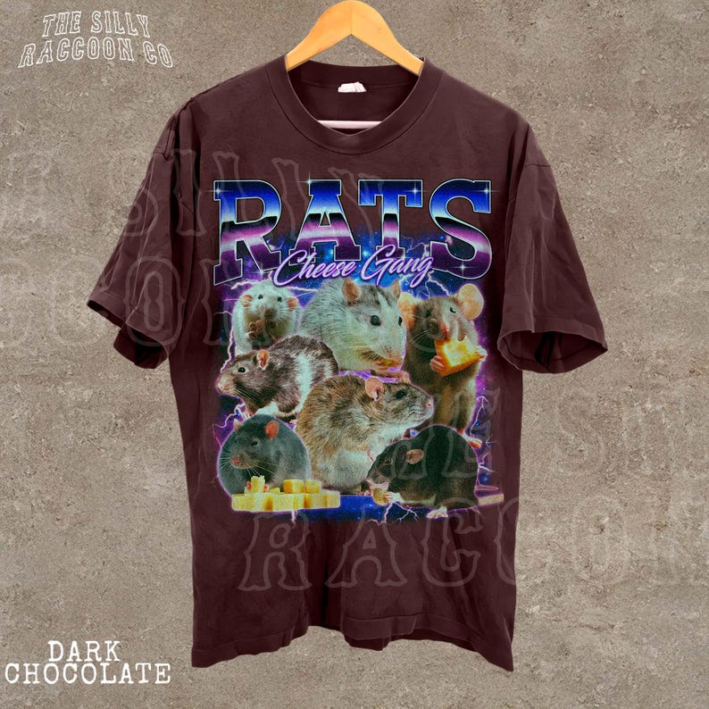 A t-shirt with a graphic design featuring a group of rats and cheese, along with the text "RATS Cheese Gang" prominently displayed.