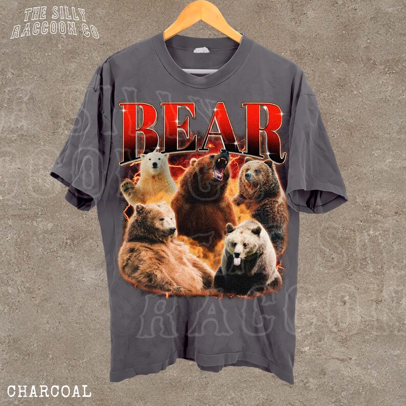 A gray t-shirt with a graphic design featuring a group of bears, including a bear with a growling expression, all surrounded by flames.
