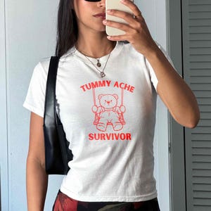Tummy Ache Survivor Shirt, Funny IBS Graphic Tee, Kawaii Bear Crop Top, Cute Y2K Style Baby Tee, Chronic Illness Humor Gift for Her