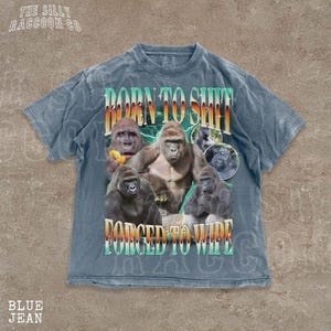 A t-shirt with a graphic design featuring a group of gorillas and the text "Born to shit forced to wipe" printed on it.