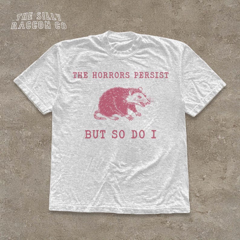 A white t-shirt with a graphic design and text printed on it.