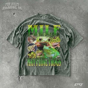 A grey t-shirt with a graphic design featuring multiple images of frogs.