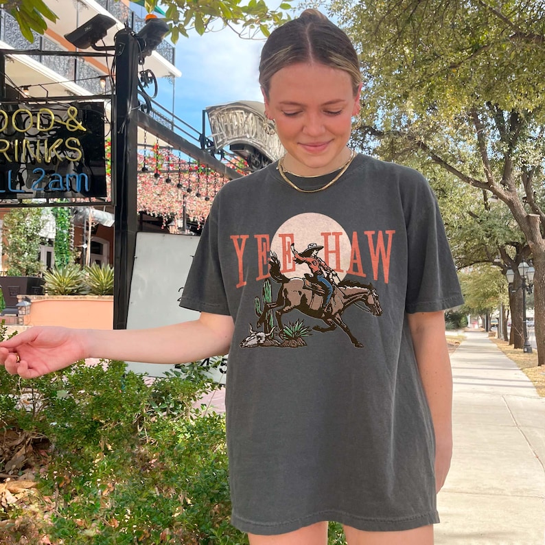 a young girl is holding out her hand