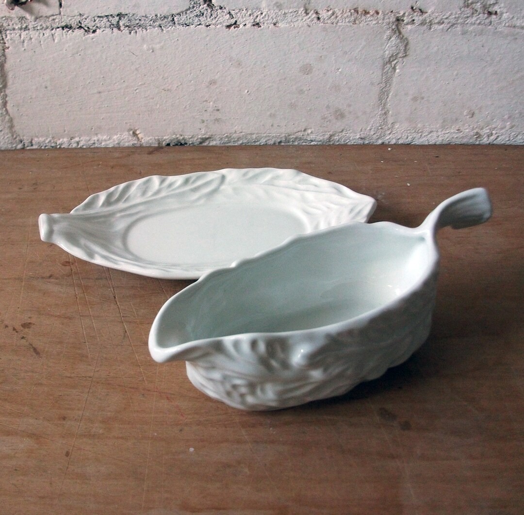 White Porcelain Serving Set. Leaf Patterned Gravy Jug and Saucer