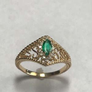 14 K Yellow Gold Marquise Emerald And Diamond Ring