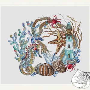 May include: A cross-stitch pattern featuring a blue and white lighthouse, a starfish, a seahorse, seashells, and crabs. The design is surrounded by seaweed and rope.