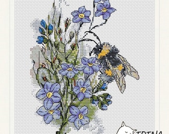 May include: A cross-stitch pattern featuring a bumblebee pollinating a cluster of blue forget-me-not flowers. The design is set against a white background.