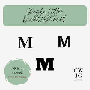May include: Image featuring three black letter "M" designs in different fonts. The text "Single Letter Decal/Stencil" is at the top, with additional text "Decal or Stencil scroll for details" and a logo at the bottom. The background is a light cream color.