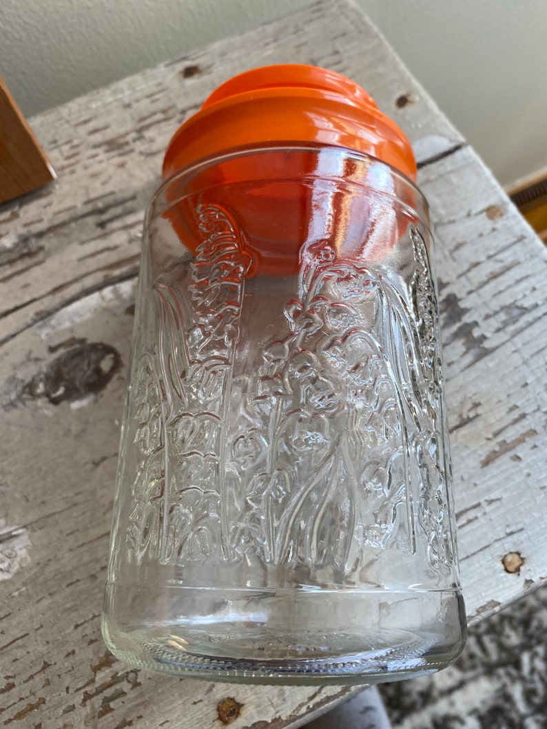Vintage Anchor Hocking Lilies of the Valley Glass Canisters Bright Orange Lids