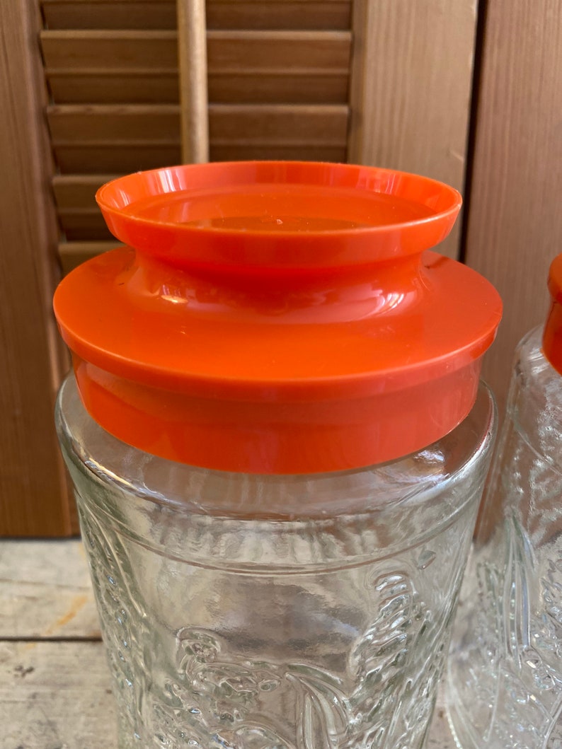 Vintage Anchor Hocking Lilies of the Valley Glass Canisters Bright Orange Lids