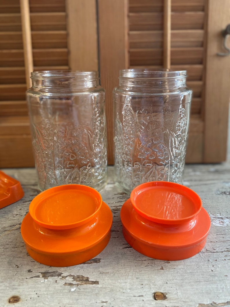 Vintage Anchor Hocking Lilies of the Valley Glass Canisters Bright Orange Lids