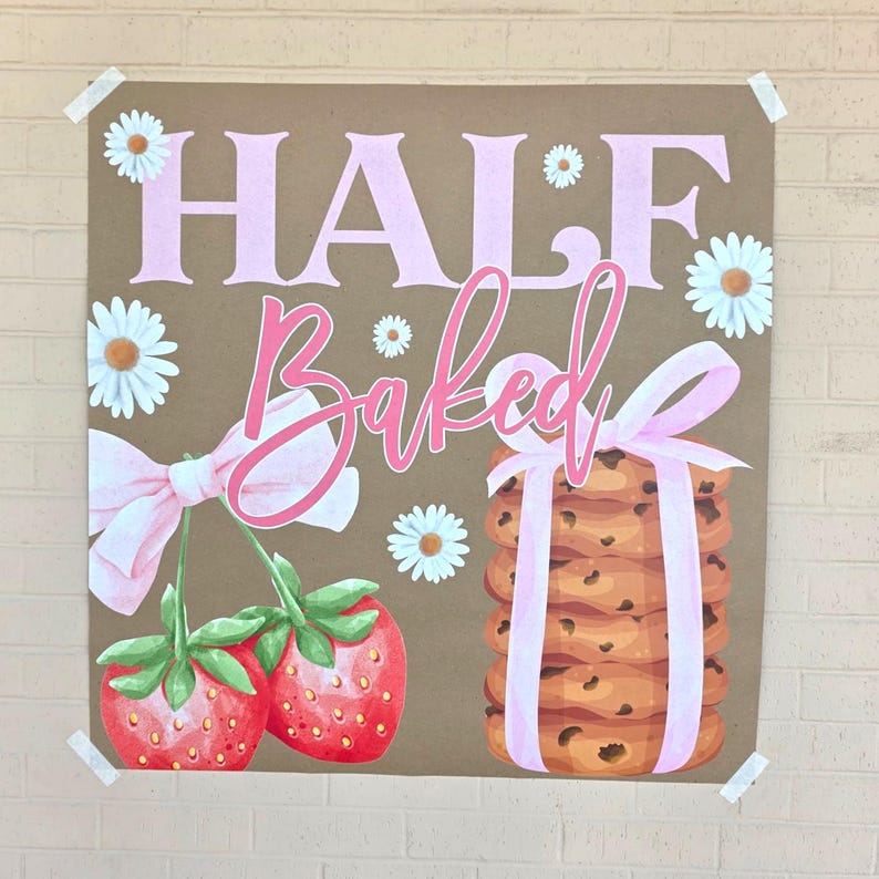 May include: A brown poster with the words "HALF BAKED" in pink, featuring illustrations of strawberries, daisies, and a stack of chocolate chip cookies tied with a pink ribbon. The poster is taped to a brick wall.