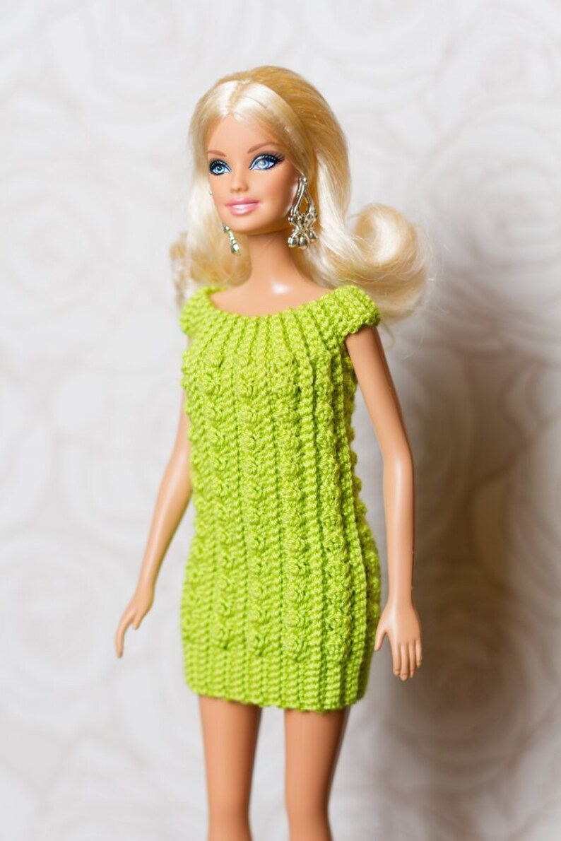 height of barbie doll in cm
