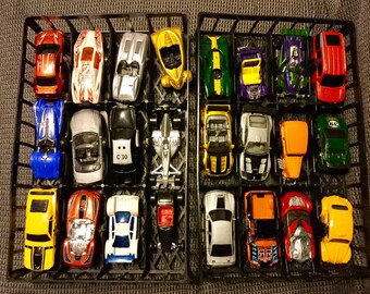 48 Hot Wheels Carrying Case With A Lot Of 30 toy cars and trucks