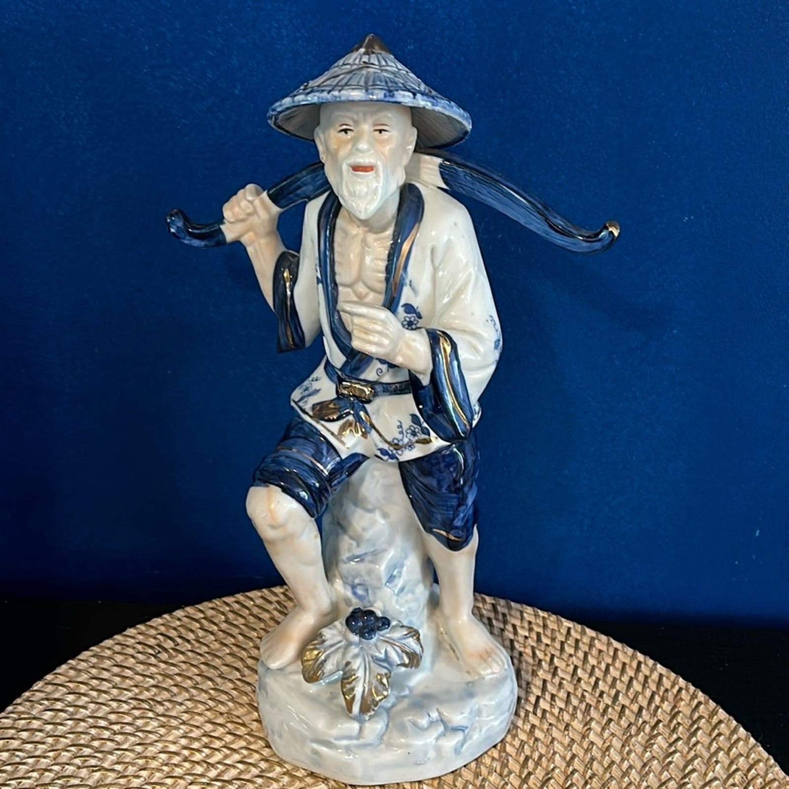 Vintage 1980 Porcelain Asian Fisherman Figurine in Cream and Tan - Unbranded main image 0