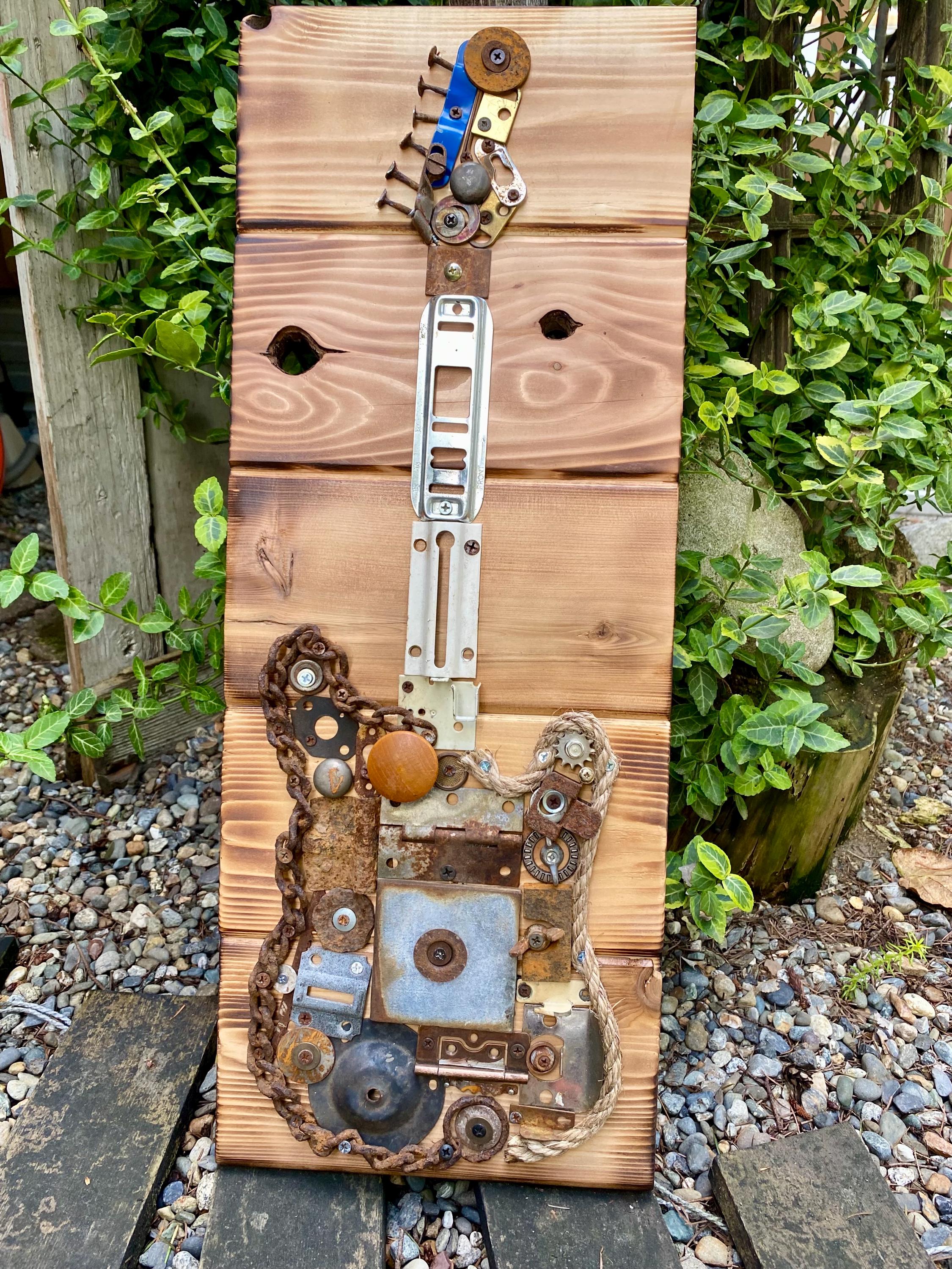 Recycled Metal Guitar Wall Art: Industrial Mixed Media Sculpture