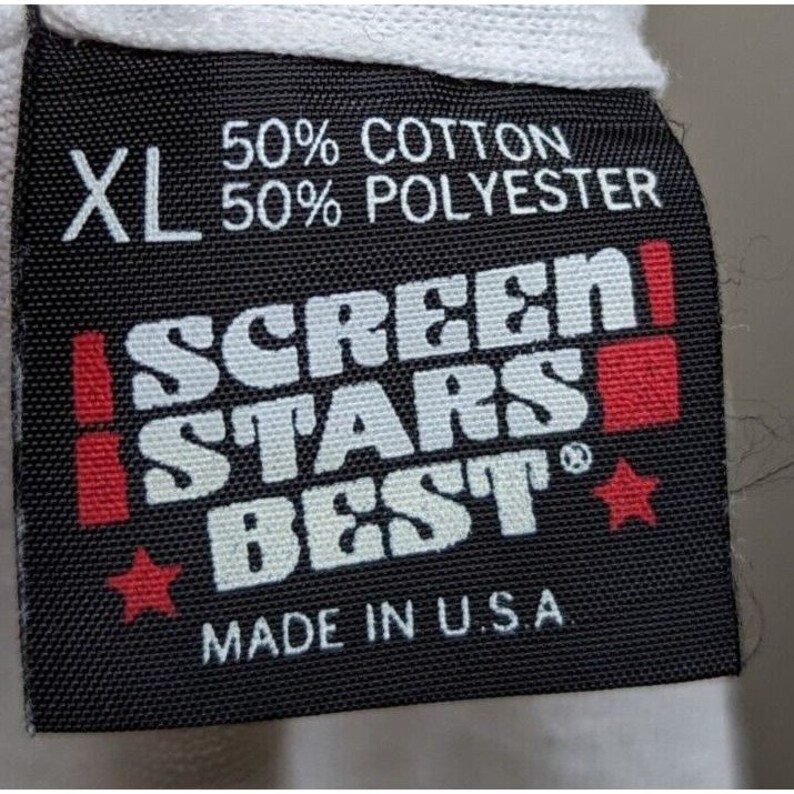 May include: Black tag with white text that reads "XL 50% Cotton 50% Polyester SCREEN STARS BEST" with two red stars and a red square. The tag also reads "Made in U.S.A."