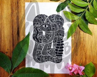 May include: Black and white print of a snake with a geometric pattern. The snake is coiled and has a single eye.
