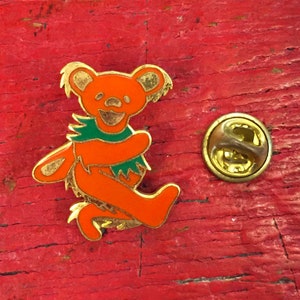Grateful Dead - Orange Dancing Bear Gold Metal Vintage Pin (New Old Stock)