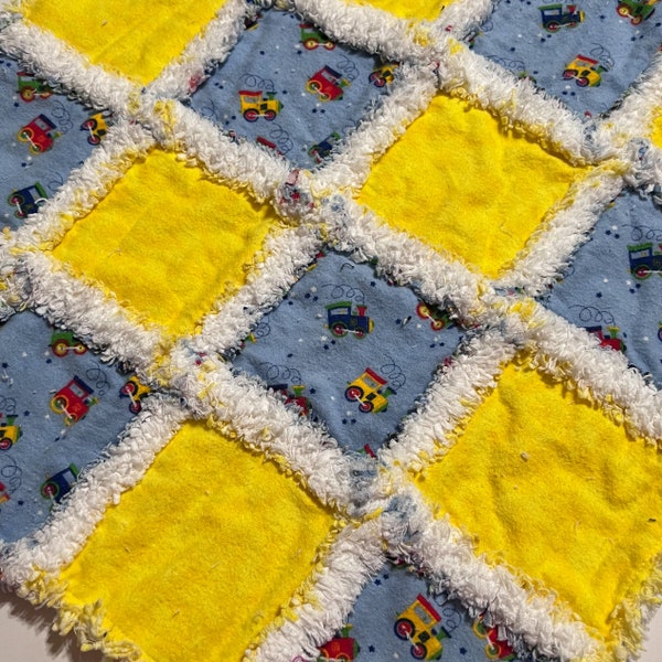 Baby boy rag quilt mini quilt lovey red yellow blue trains on blue surrounded by yellow